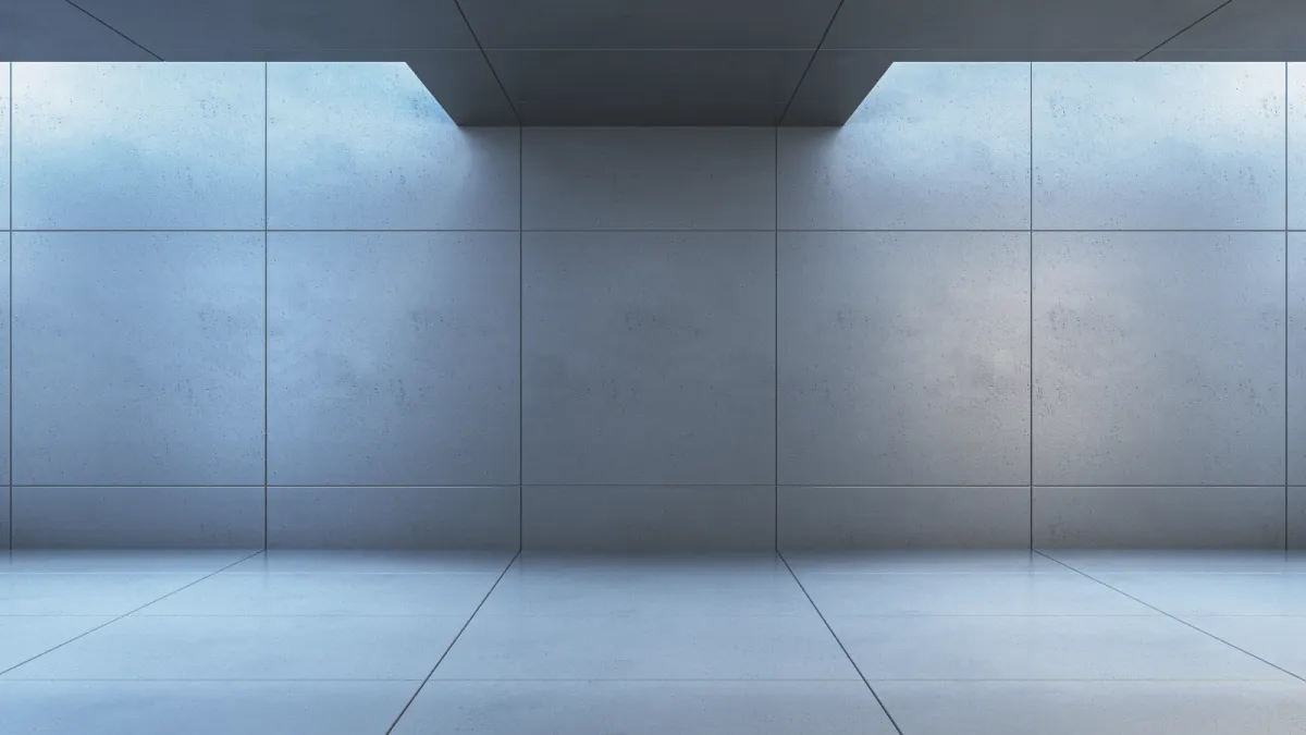 Minimal architectural stone surface with light and shadow, conveying clarity and focus