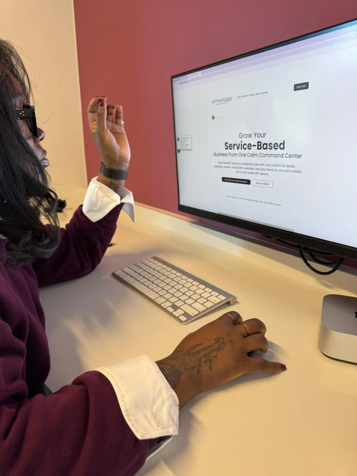 A 3:2 photorealistic group shot of a small, diverse women’s mastermind in a bright meeting room, candid conversation around a table with laptops and notebooks, warm natural light, authentic community vibe and professional styling.