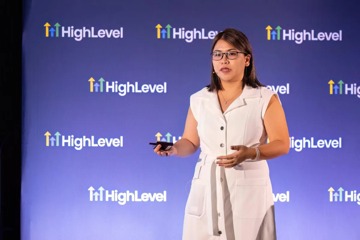 A Filipino virtual assistant looking frustrated at a cluttered screen, digital chaos around, muted SaaS palette, 1:1 aspect ratio