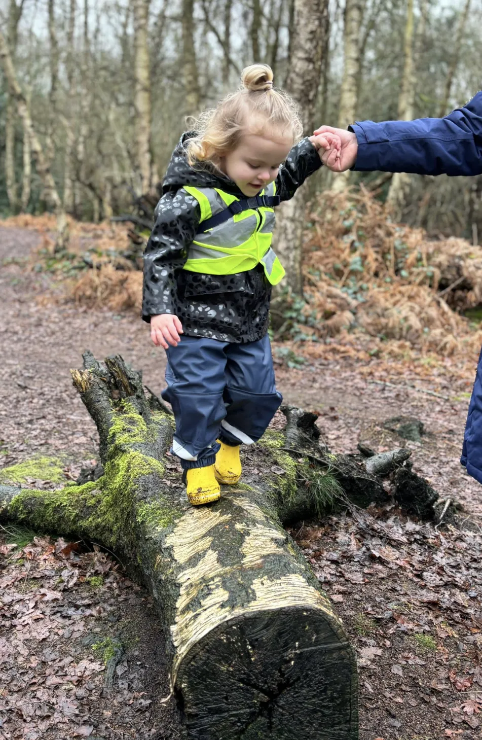Modern, light and spacious nursery playroom with children engaged in activities