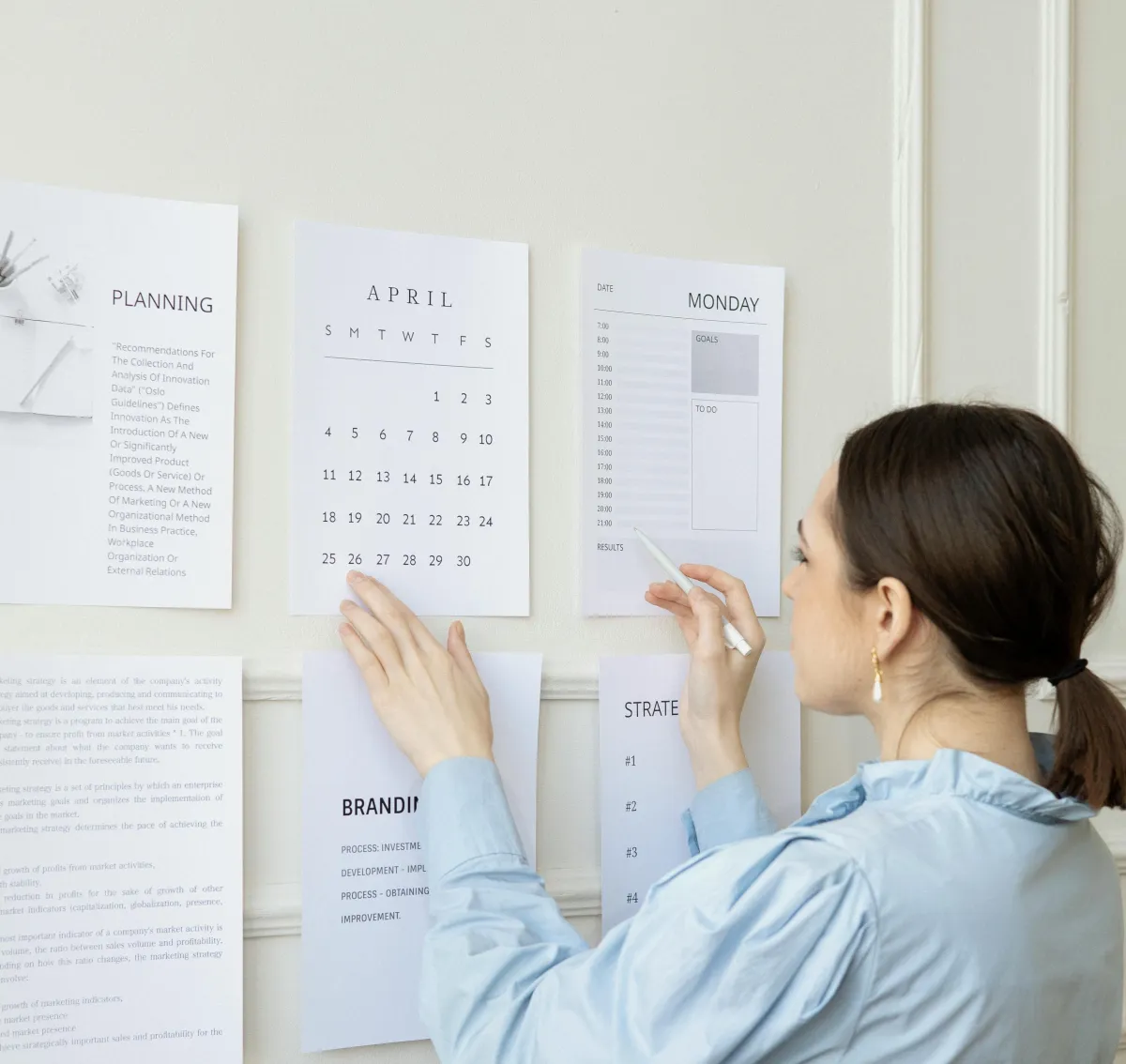 A woman writing her branding strategy on the wall