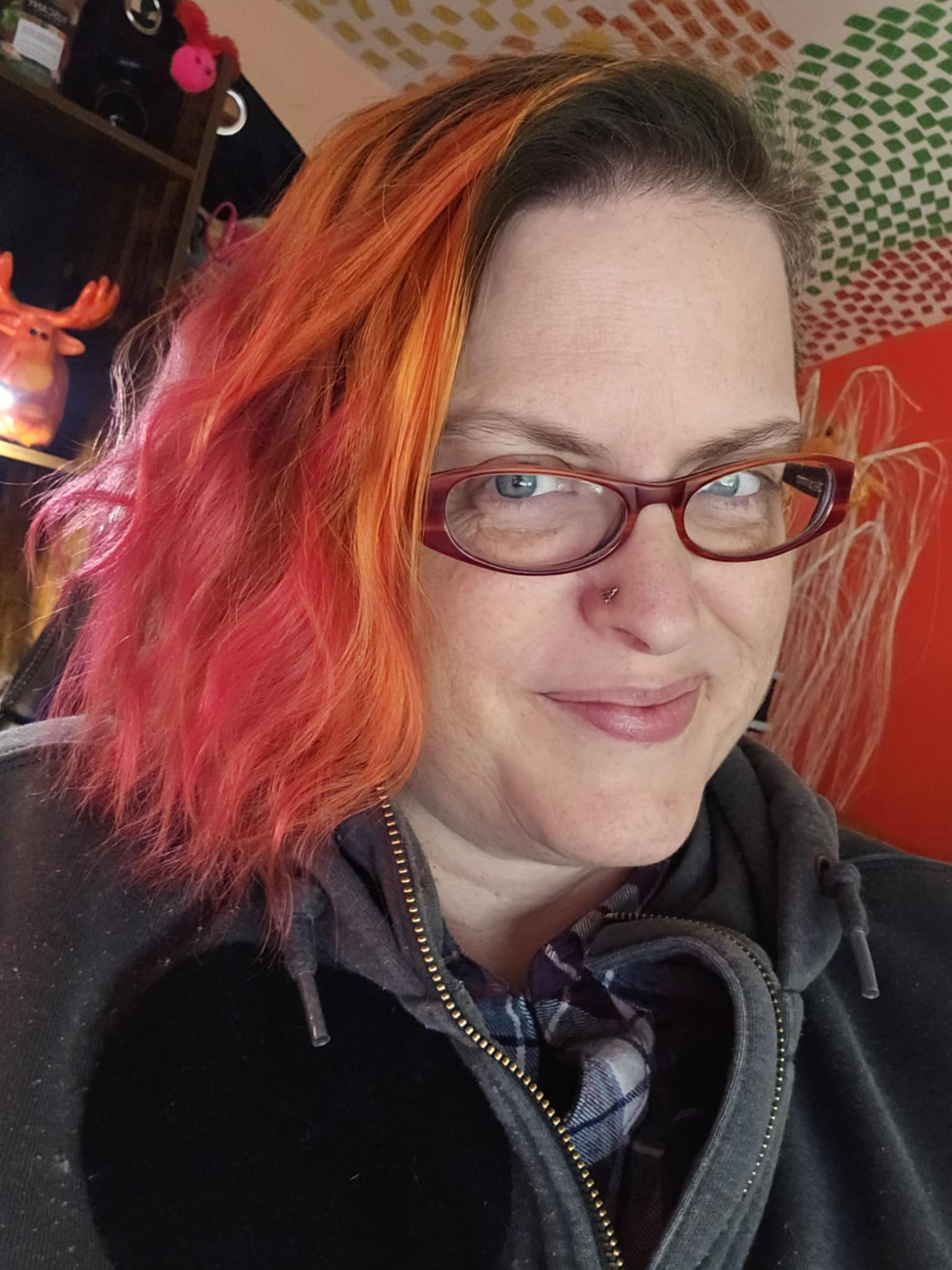 Cheerful woman with curly hair, holding a notepad and pen, stands before a chalkboard filled with business diagrams. The illustration is playful, hand-drawn, and uses warm neutral colors, conveying approachability and expertise in a creative workspace.