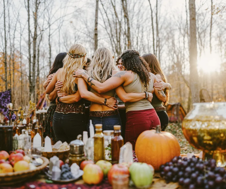 Women gathered in circle outdoors, sharing community, connection, and sacred reflection during a seasonal women’s gathering.