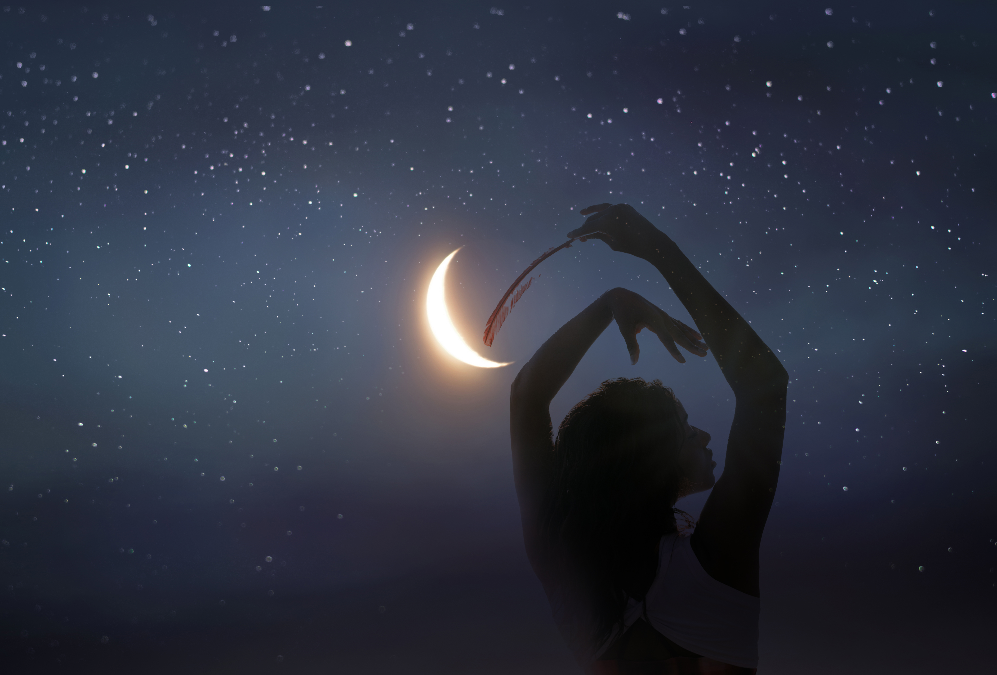 Spiritual guide in a blue cloak standing by a tree in autumn woodland, connecting with nature and the Wheel of the Year.