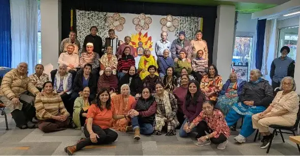 Caregiver assisting elderly client with daily living activities at home near me