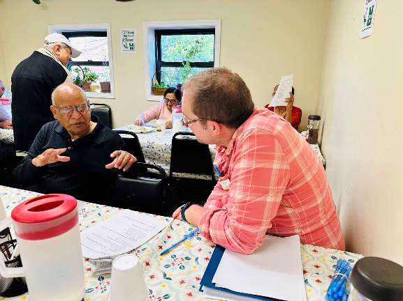 Caregiver providing companionship and emotional support to elderly senior