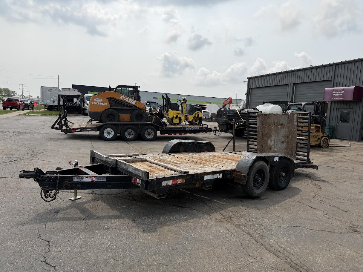 Used tandem axle car and equipment trailer for sale with wood deck and rear loading ramps