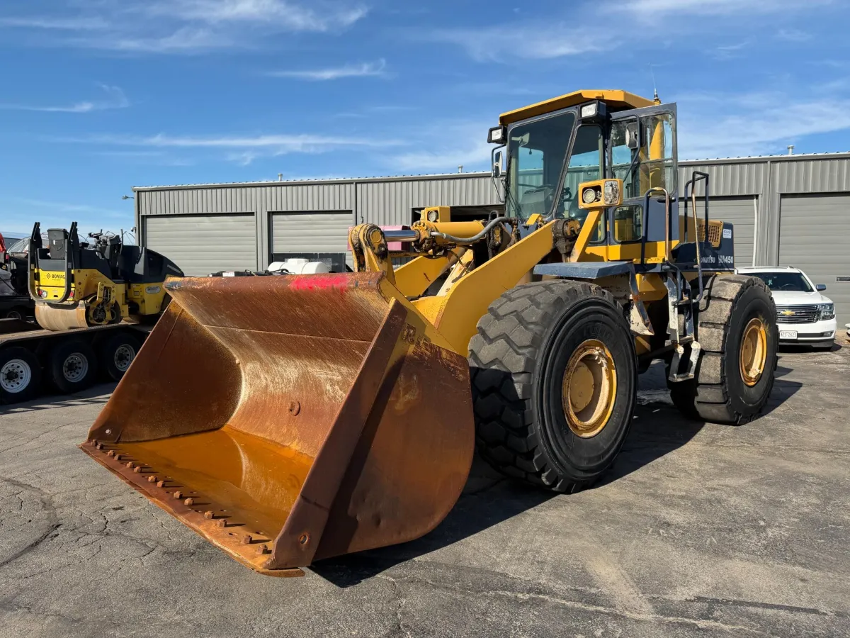 Komatsu WA450-2 wheel loader with enclosed cab and front bucket for sale in Appleton, Wisconsin.