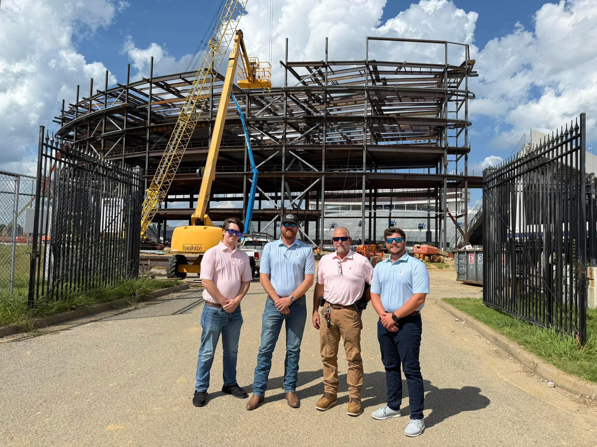 A small business owner records a product demonstration in a bright retail space, with professional lighting and a camera crew. The setting is lively and authentic, highlighting real business activity. 3:2 aspect ratio.