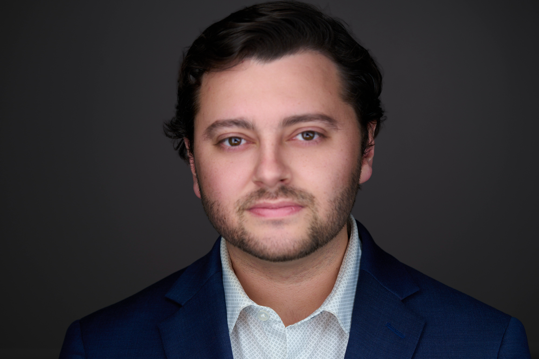 Clean corporate headshot in Memphis office setting