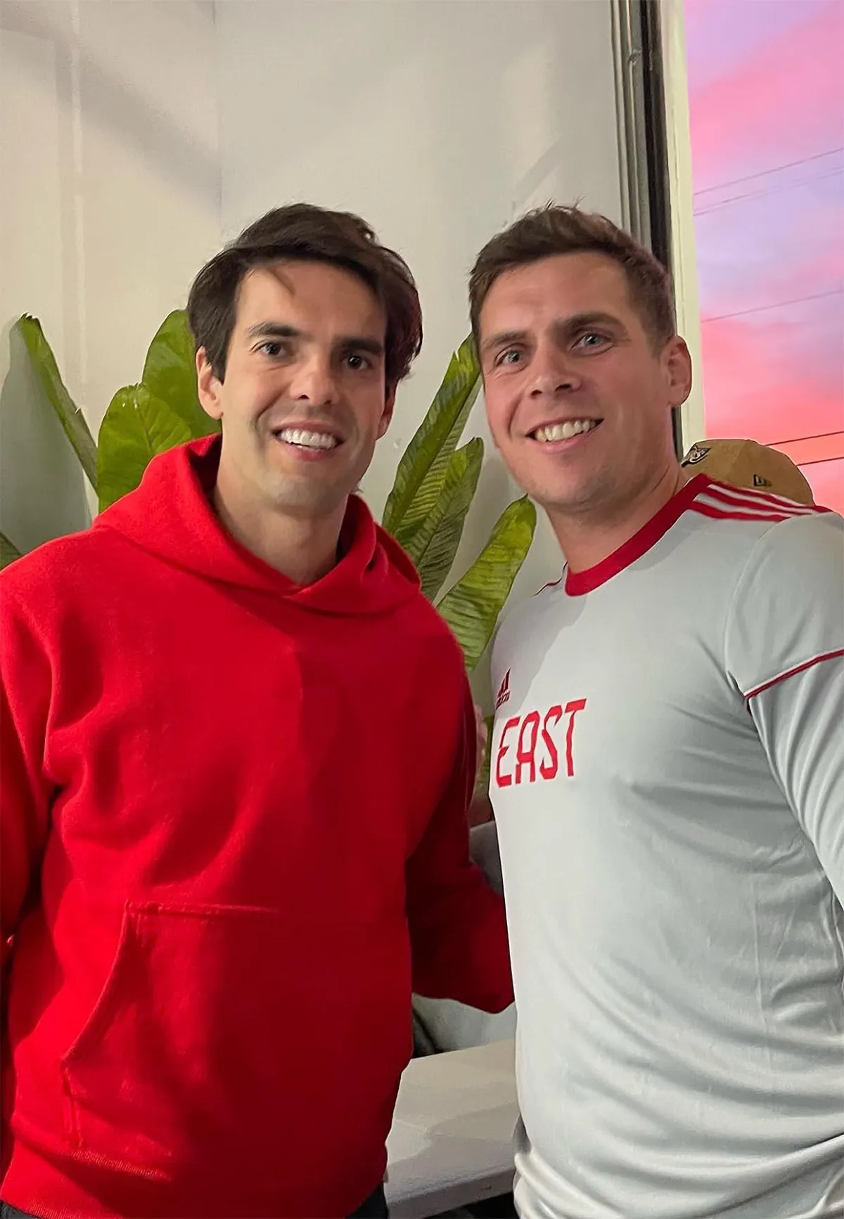 Matthew McNab interacting with a professional soccer player (Kaká) at an LA networking event—a connection to pro-level sport.