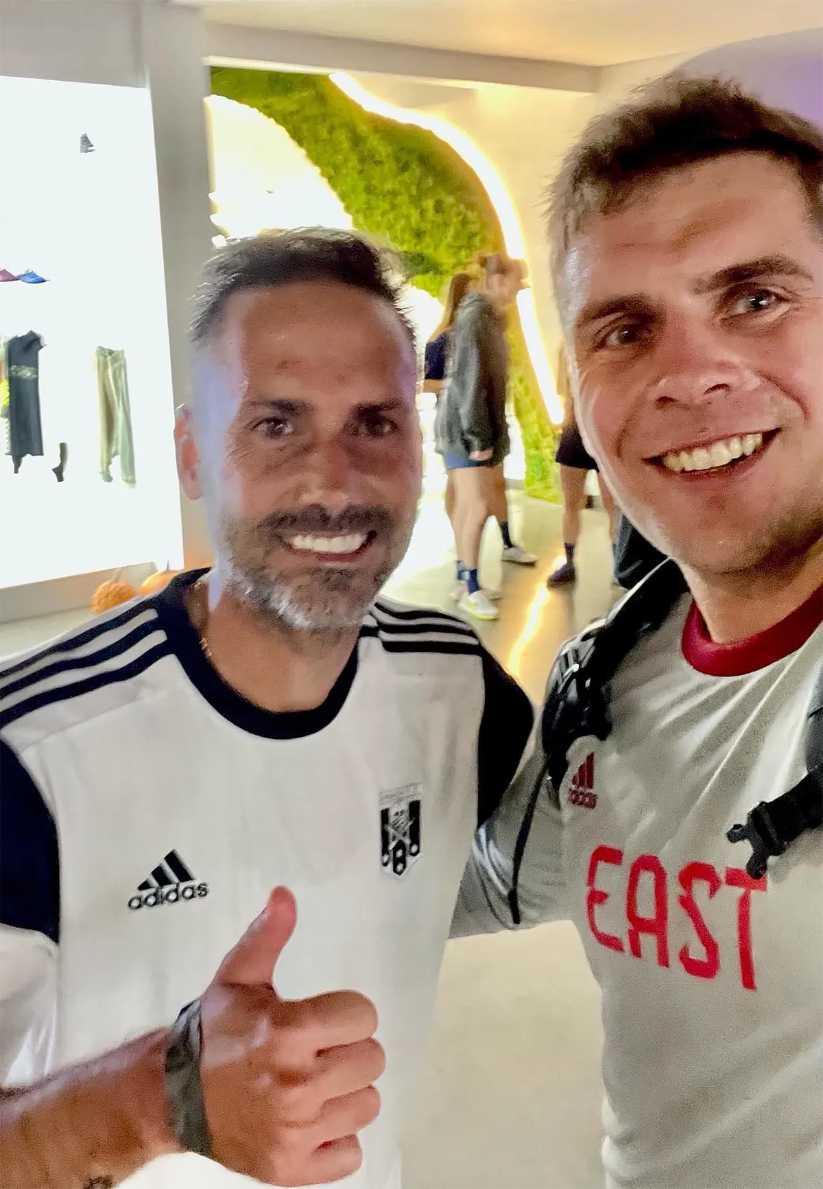 Matthew McNab and Marcelo Sarvas conversing at an event—highlighting mentorship with elite athletes.