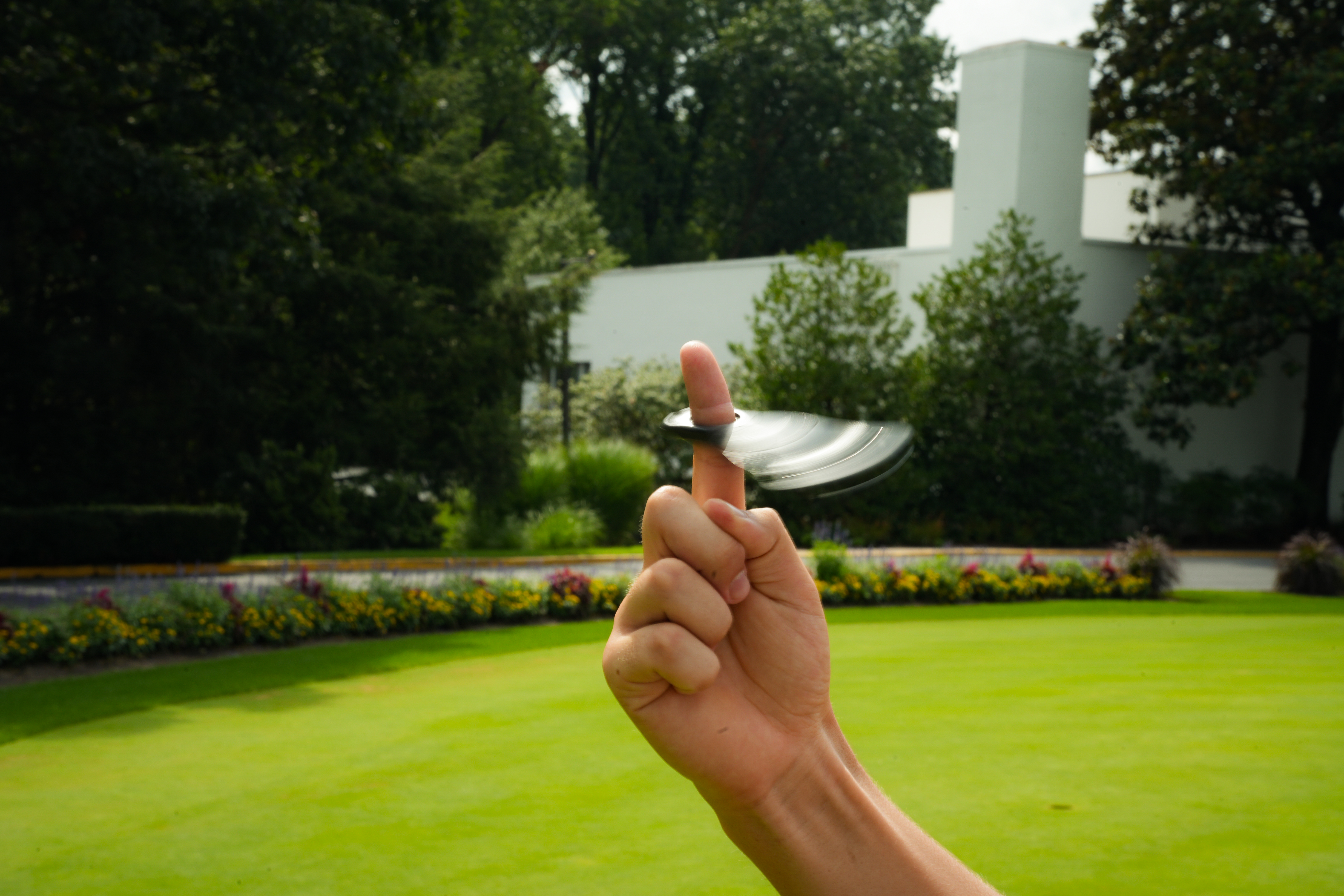 Golfer fidgeting with Fidgix Pro divot tool between shots.