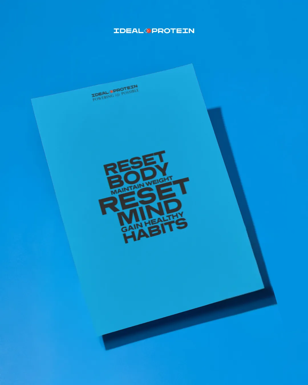 Ideal Protein blue phase 2 folder with the words Reset Body Reset Mind Reset Habits displayed on the cover