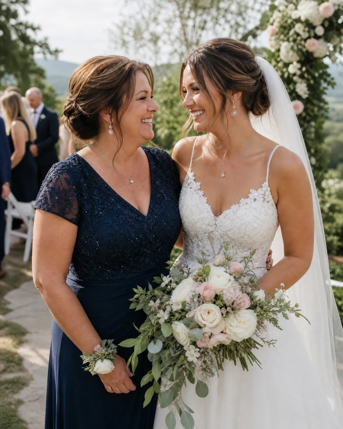 Woman in a navy dress smiling with a bride at an outdoor wedding ceremony, representing a personal milestone goal achieved through a structured weight loss program