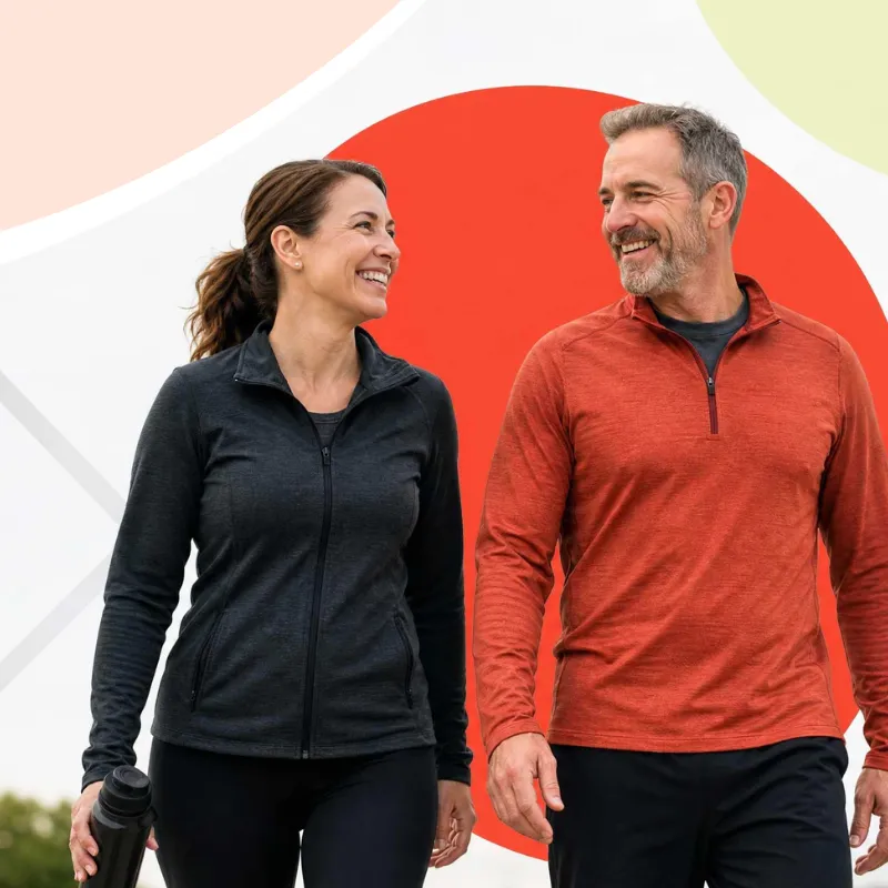 Two happy, active adults walking together after achieving their weight loss goals with the Ideal Protein Protocol at Ideal Weight Loss online