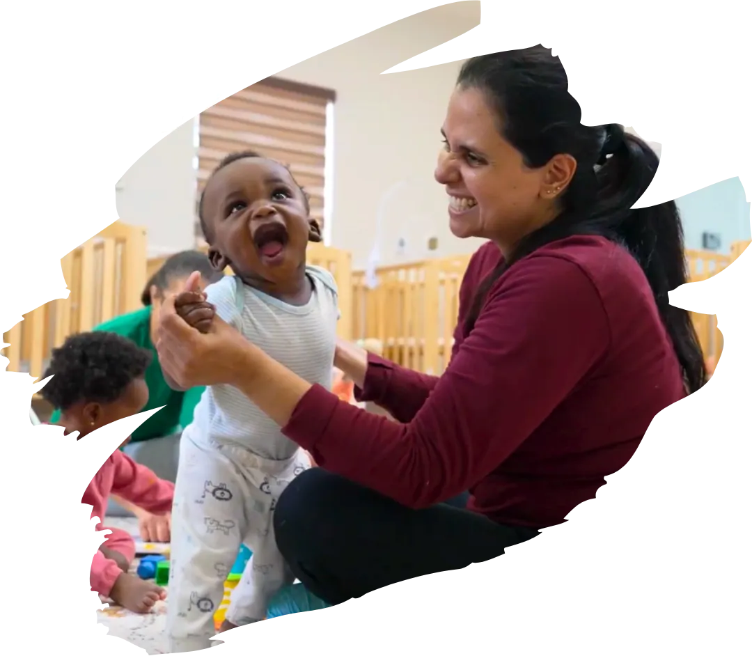 teacher playing with baby