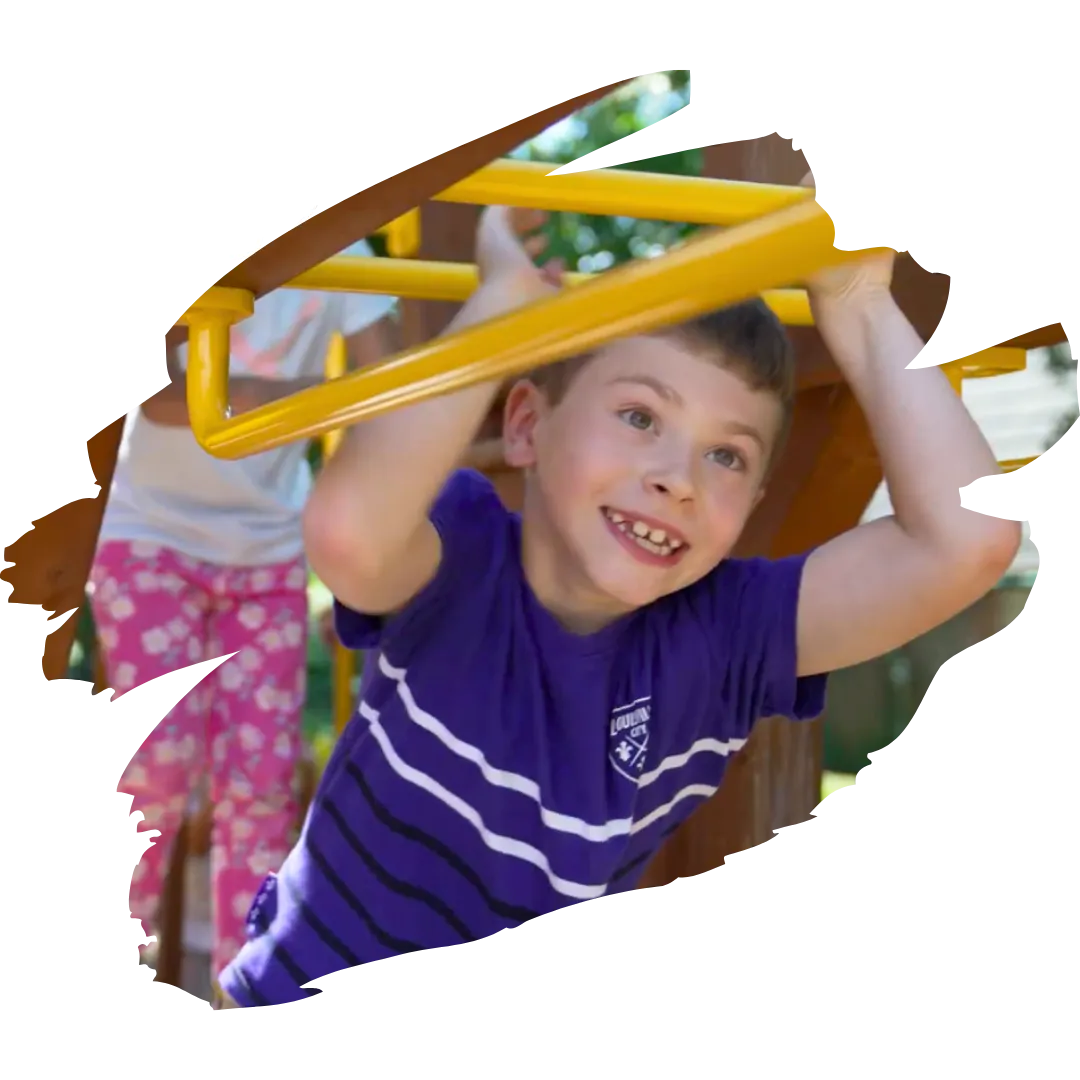 preschooler playing in monkeyjungle outside