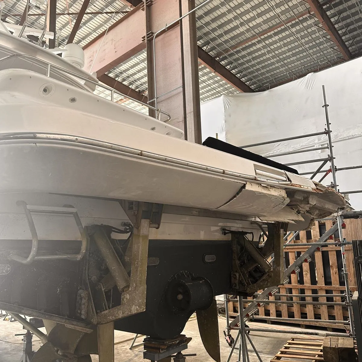 Before: damaged stern and swim platform on arrival at Lauderdale Marine Center