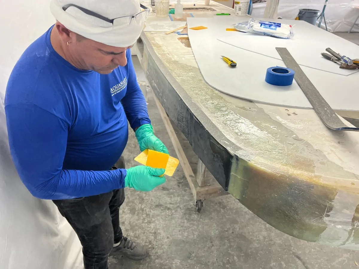 Aquamare composite technician working on the rebuilt platform