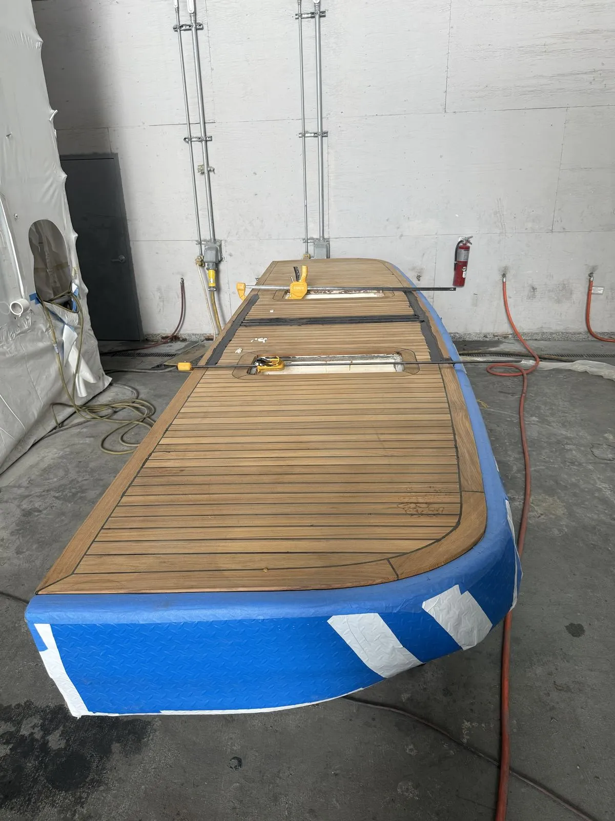 New teak decking laid on the rebuilt swim platform