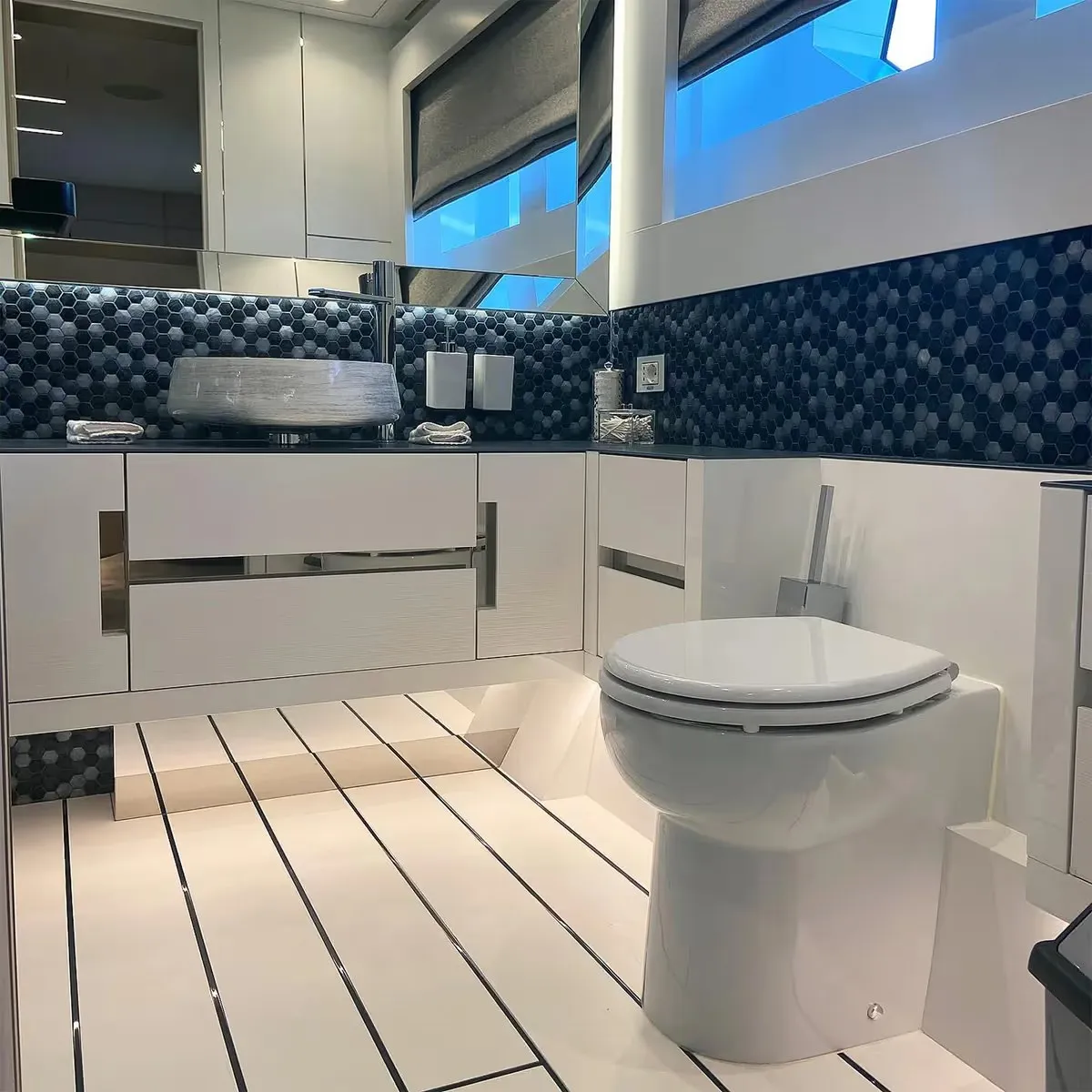 Yacht bathroom fitted with a Planus marine toilet