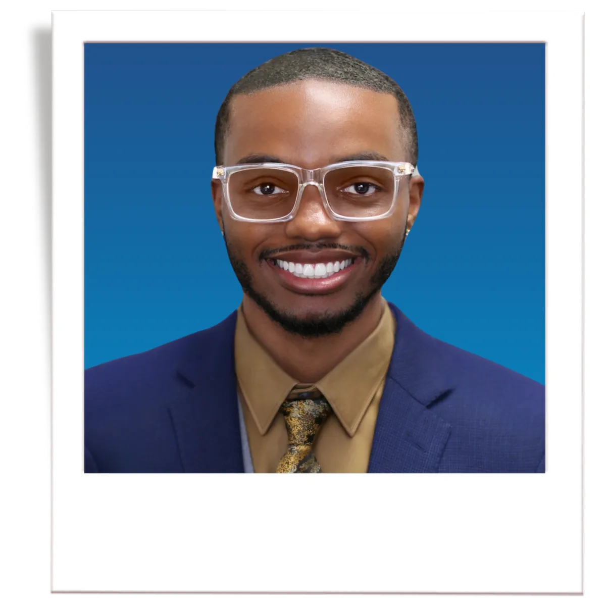 A picture of professional insurance agent, Noe Recendez. The picture is in the style of a polaroid. The insurance agent is wearing a dark grey men's blazer, a blue button down shirt, and a black tie. The agent is in front of a blue gradient background. 