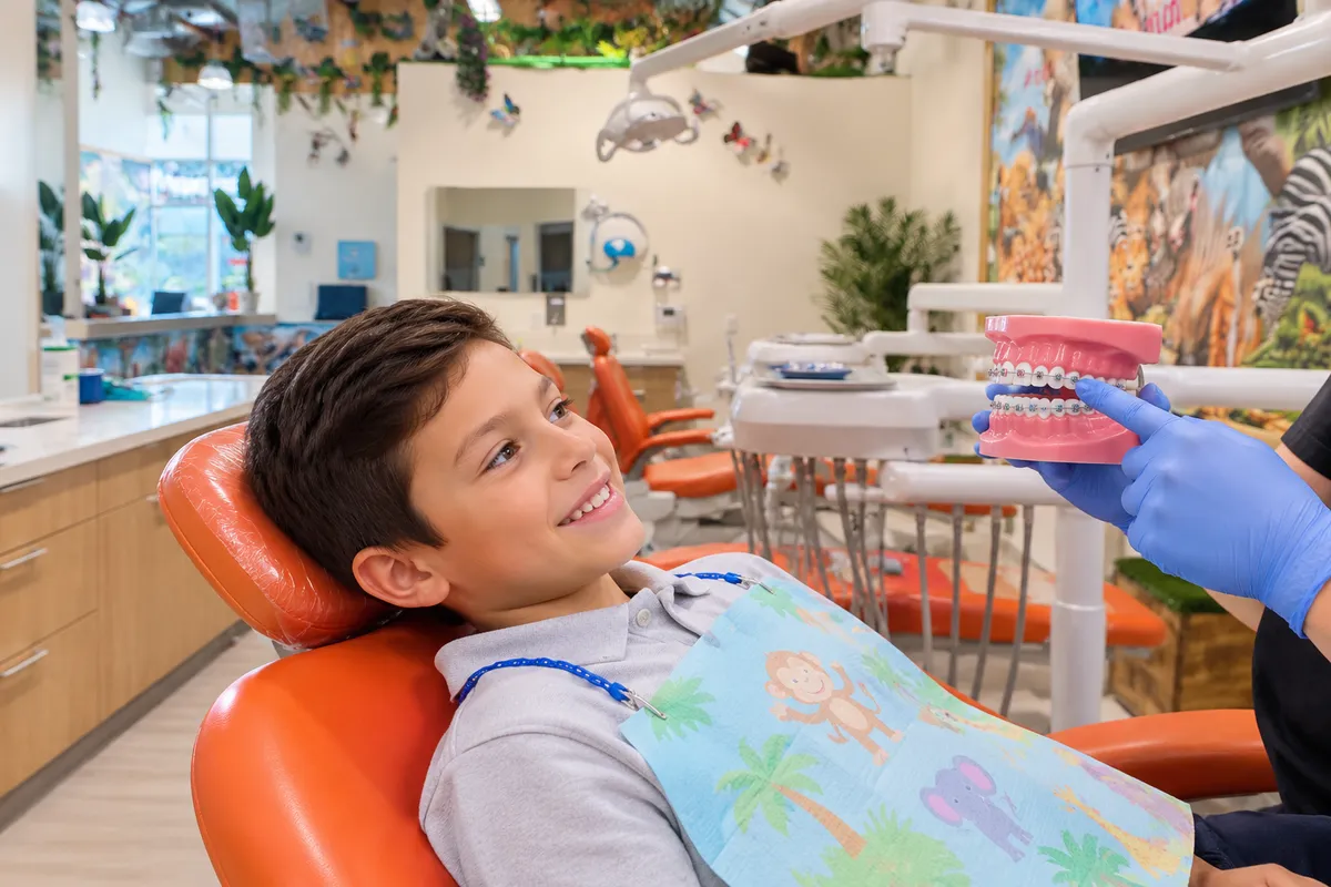 Child receiving supportive dental care at a pediatric dental office