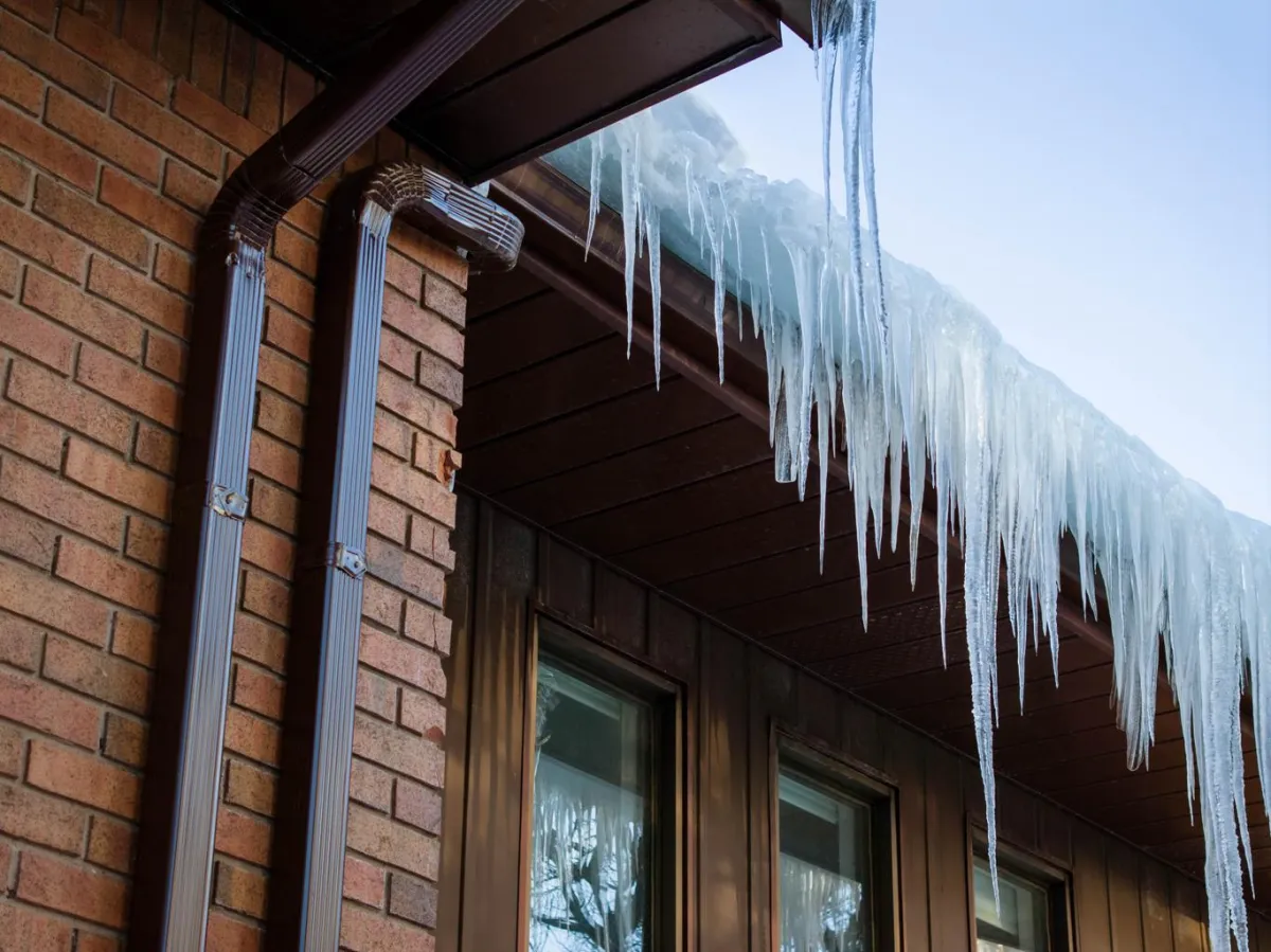 ice dam roof damage in Grande Prairie causing roof leaks