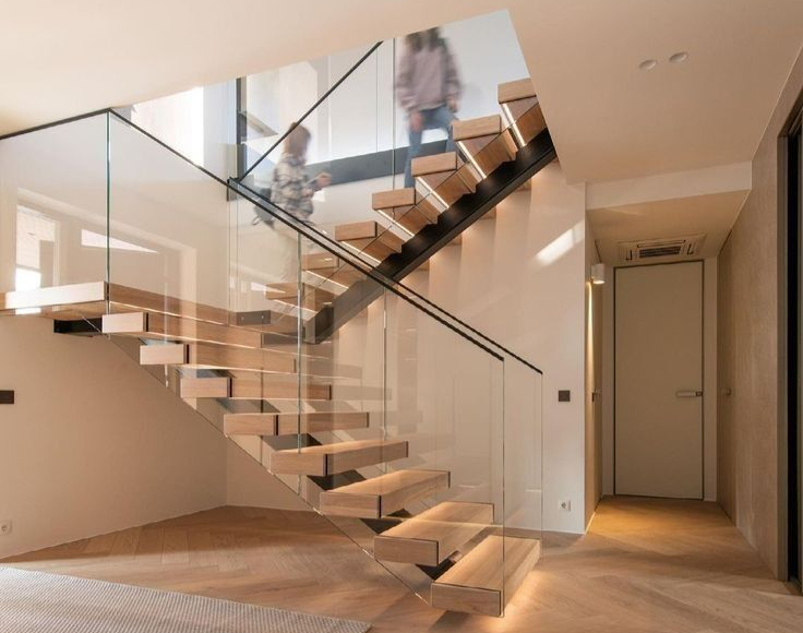 Concrete stairs with metal handrails leading upwards