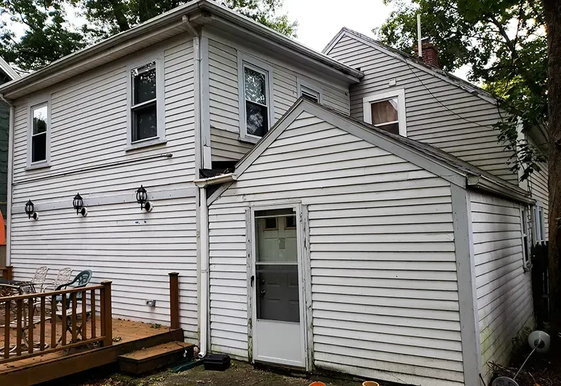 Roofing repair in MA team fixing shingles