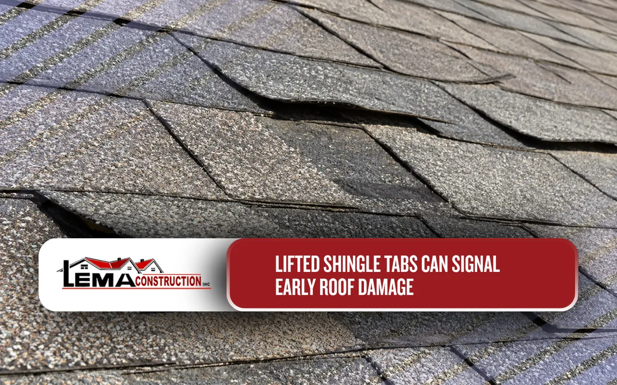 Shingle tabs lifting along an asphalt roofing surface