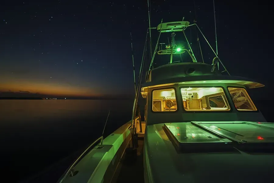 Night specialty charter: RingMaster cockpit glow with rods set and calm seas