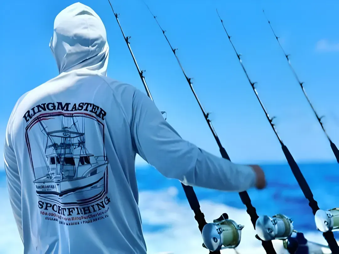 Captain on deck with trolling rods, RingMaster Charters—offshore fishing near Pompano Beach, FL.
