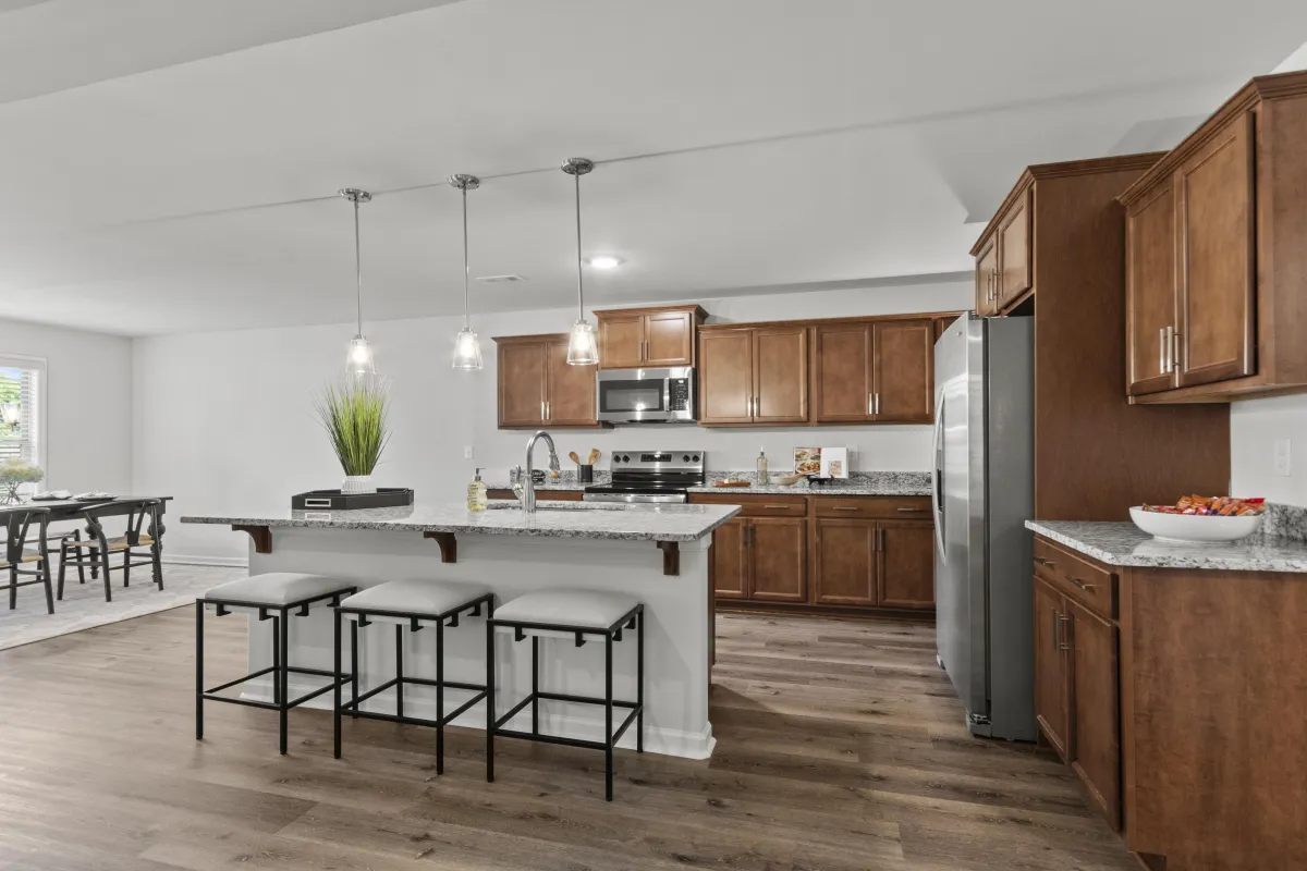 a kitchen with a stove top oven next to a window
