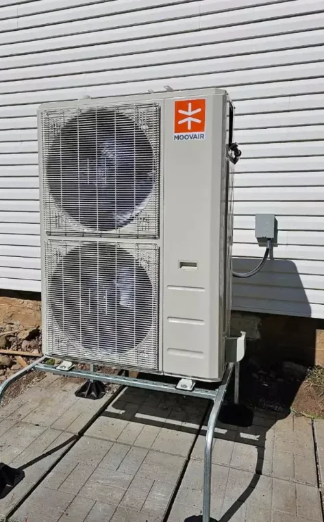 Outdoor heat pump unit installed on a residential property in Tauranga