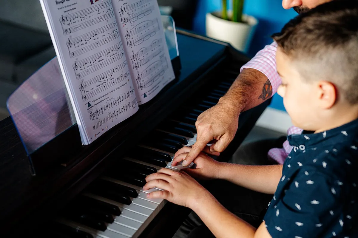 person playing black and white piano