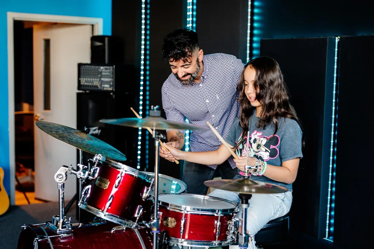 person playing brown violin