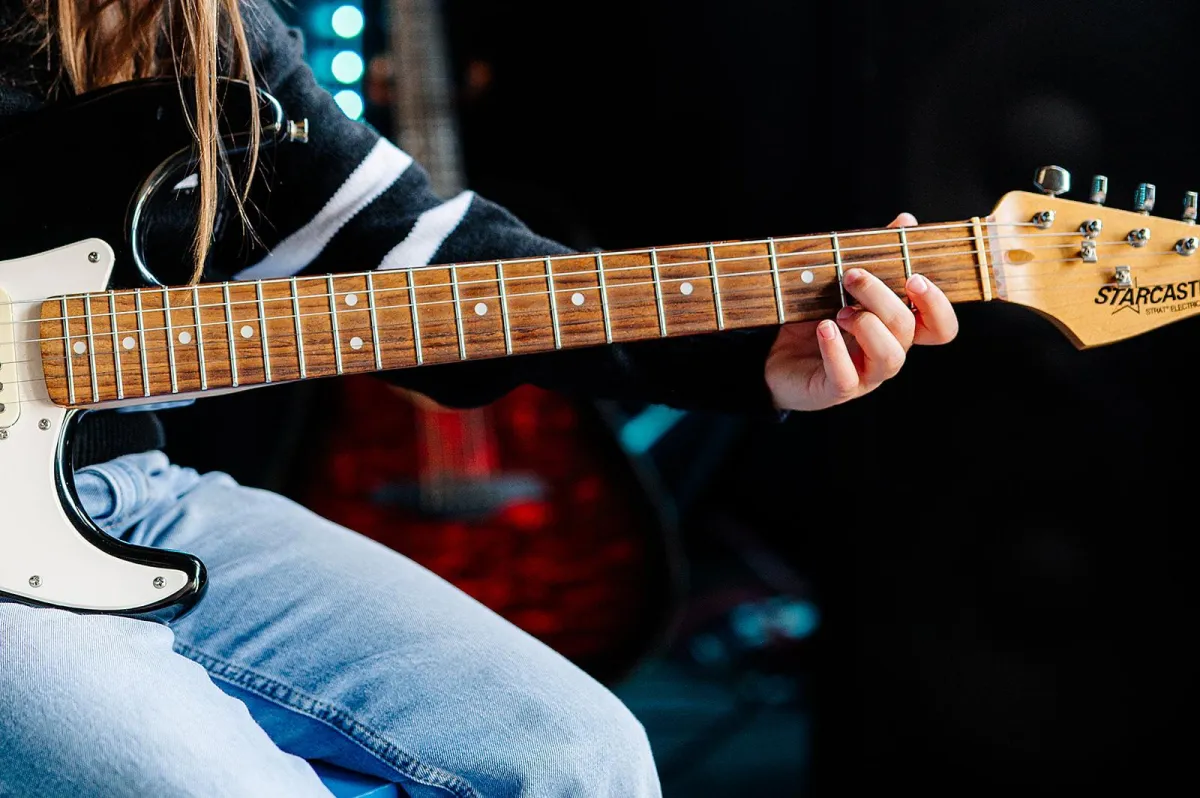 grayscale photography of guitar heads