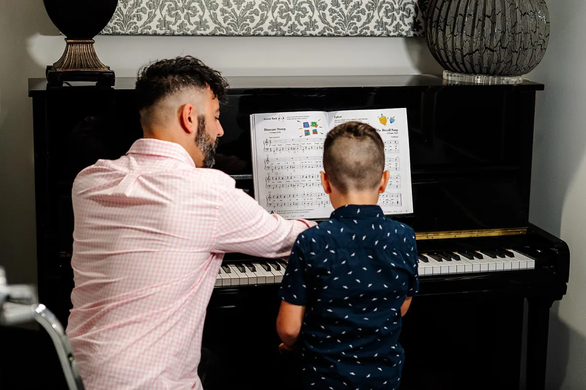 person playing black and white piano