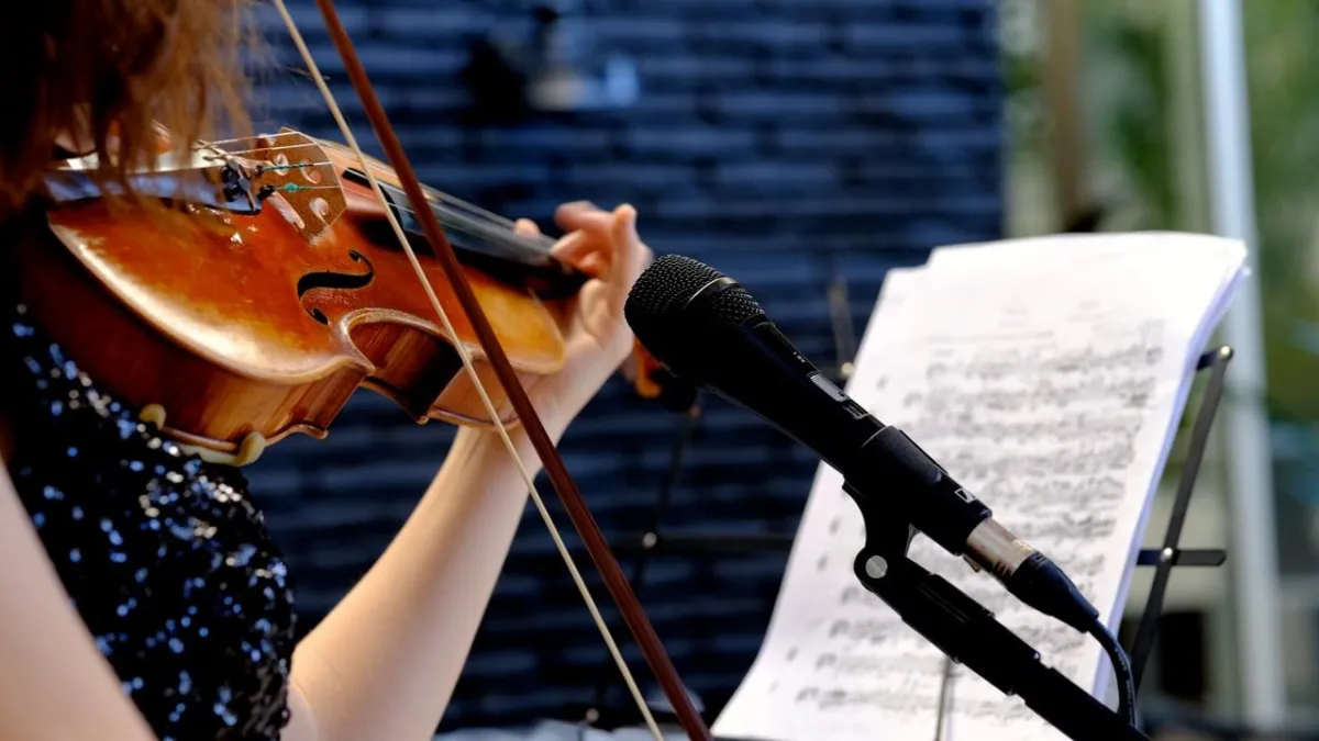 a close up of a person's hand on a piano
