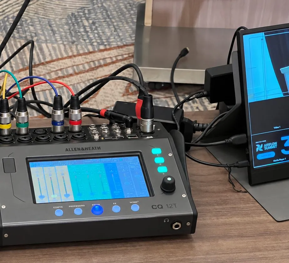 Digital mixer and playback monitor at the conference tech table