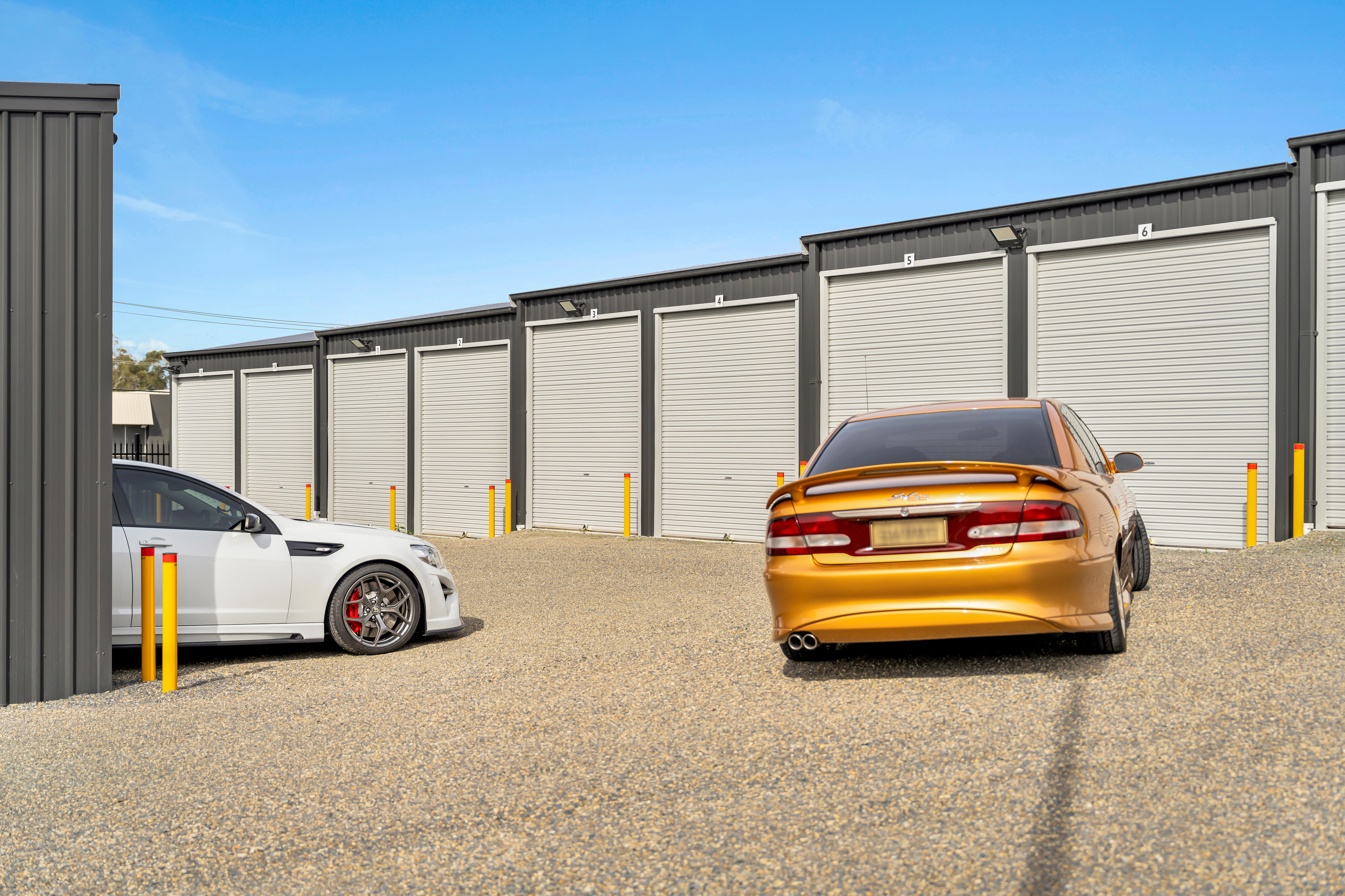 a row of storage units in a parking lot