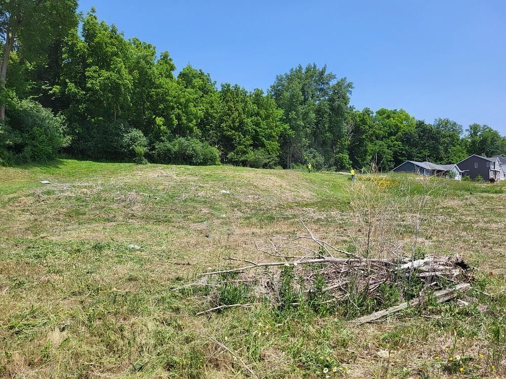 a living room filled with furniture and a kitchen