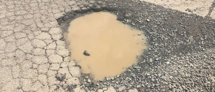 Standing Water = Structural Damage: The Parking Lot Drainage Problem Destroying Asphalt