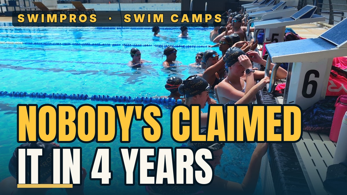 Swimmer celebrating a personal best time at a performance swim camp