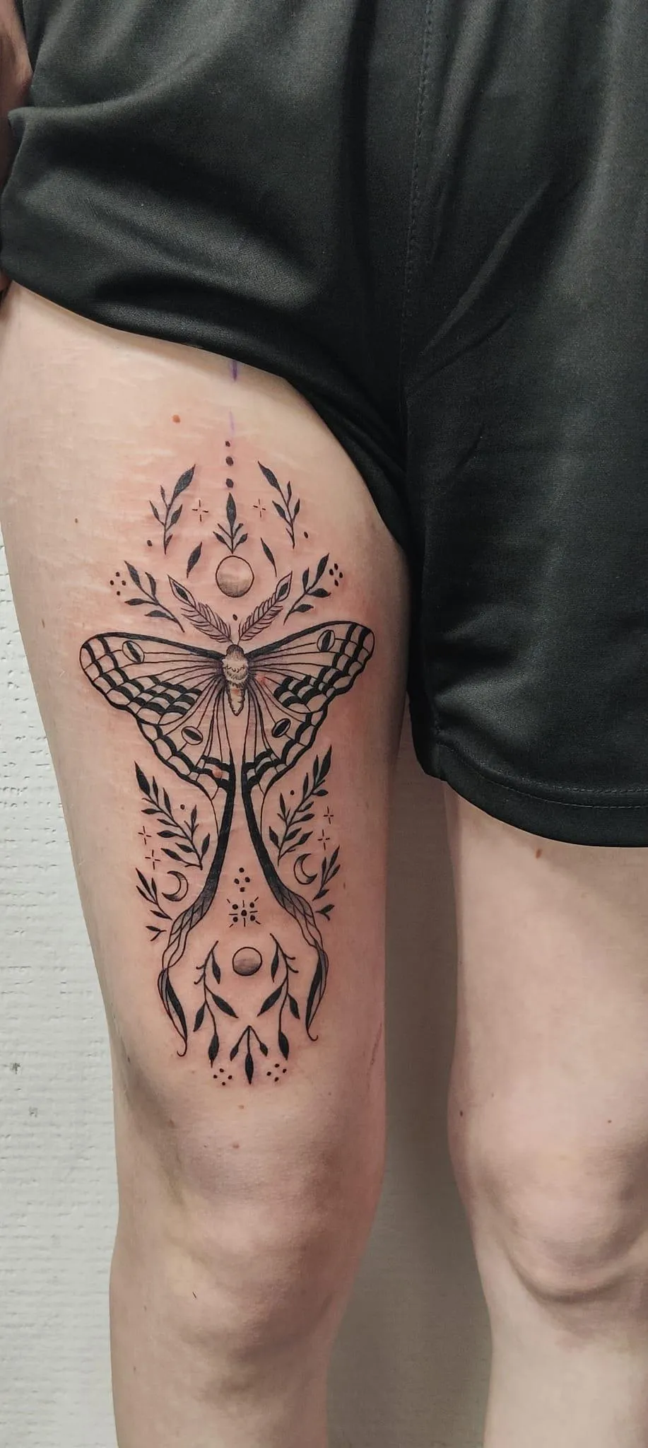 person with tattoo on right arm