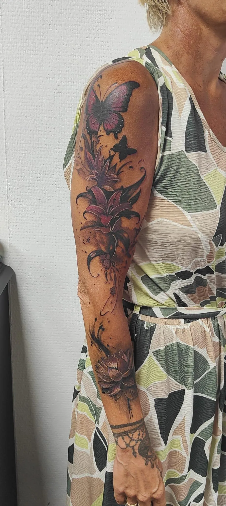 person in blue denim shorts and white nike sneakers standing on gray concrete floor