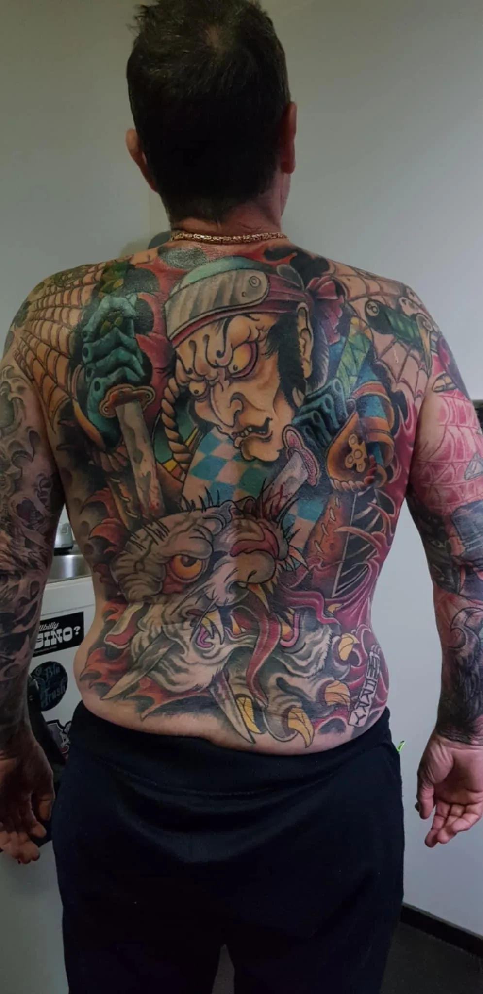 person with tattoo on right arm