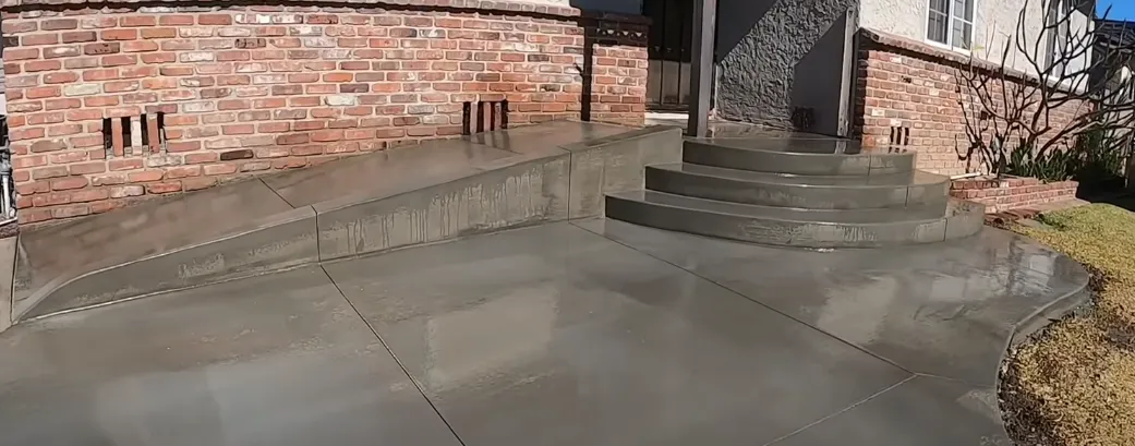 concrete steps and entryway in a plain concrete design